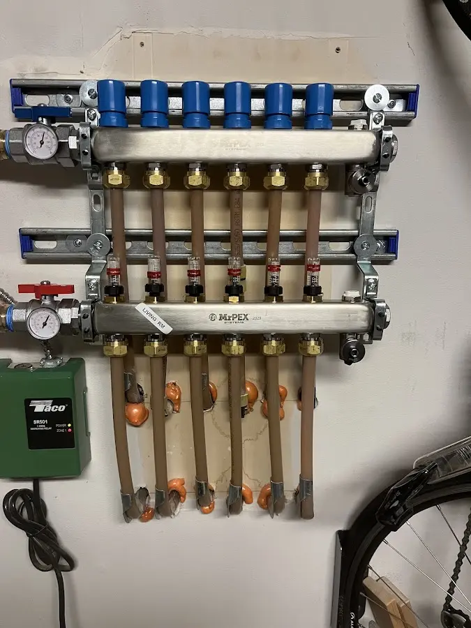 Plumber performing Water Heater Repair at a residential property in Bainbridge